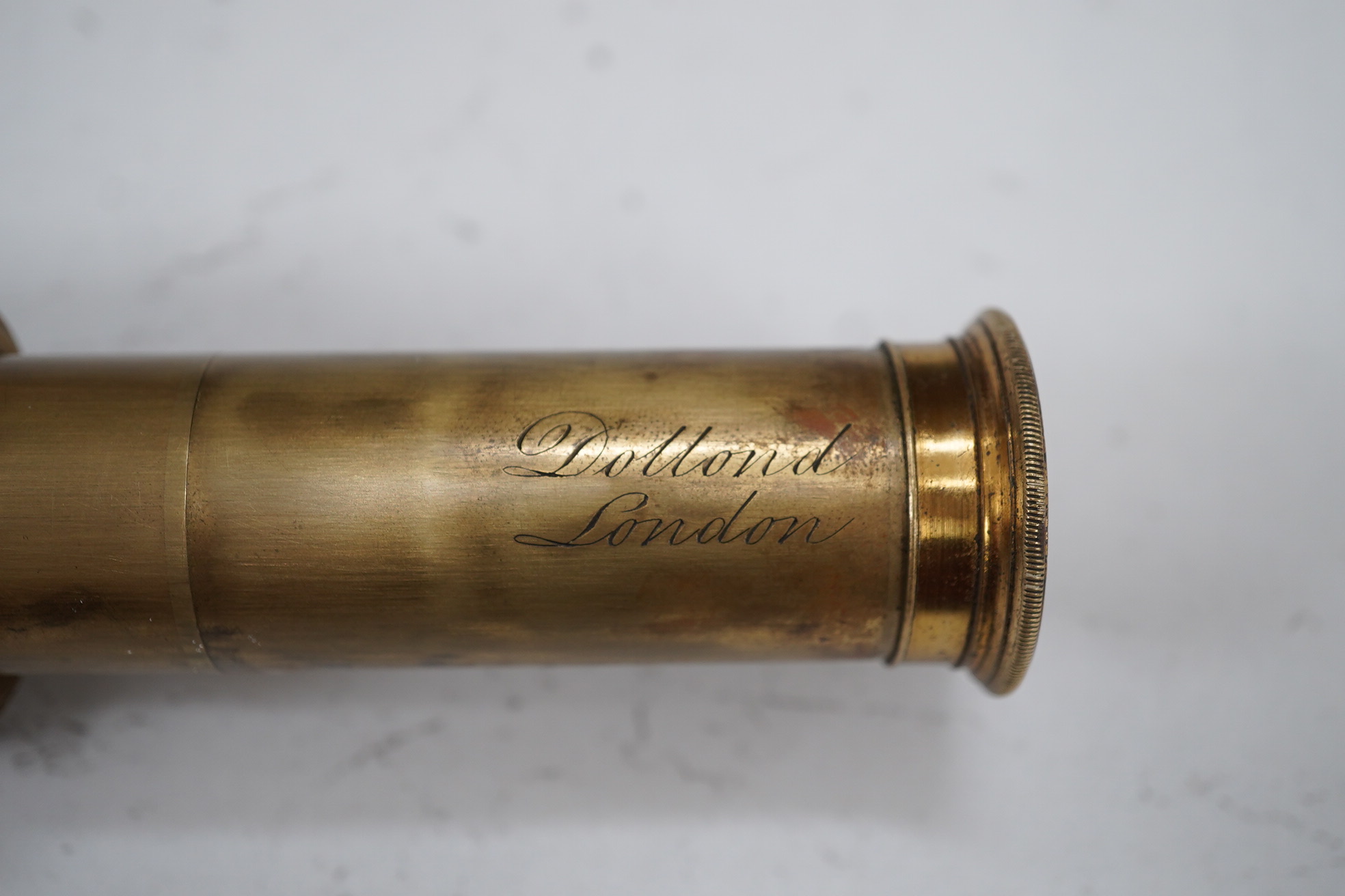 A leather cased Dolland three draw telescope, 72cm fully drawn. Condition - fair considering use